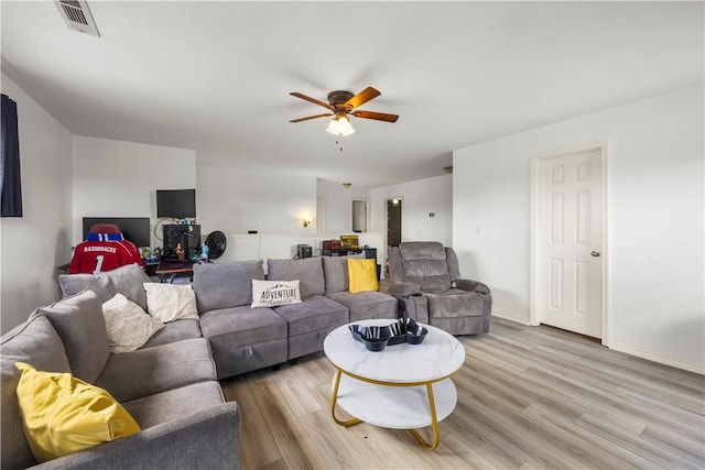 4208 SW Fieldstone Blvd, Bentonville, AR 72712 - living room featuring a ceiling fan, light wood-style flooring, and baseboards