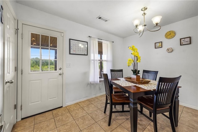 4208 SW Fieldstone Blvd, Bentonville, AR 72712 - dining area featuring plenty of natural light, a chandelier, and light tile patterned floors