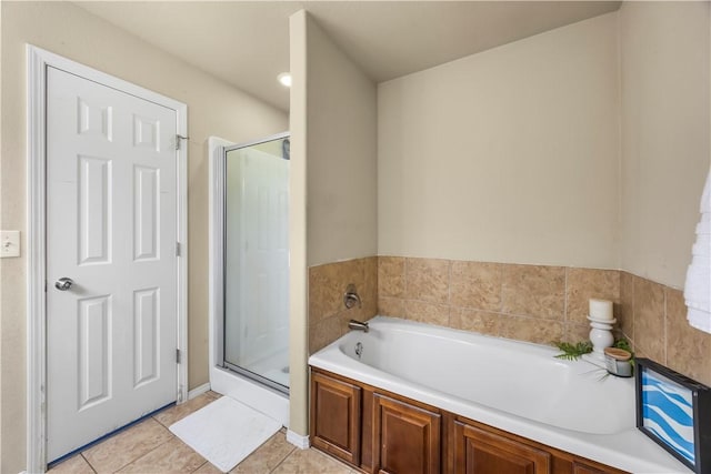 4208 SW Fieldstone Blvd, Bentonville, AR 72712 - full bathroom with a stall shower, a garden tub, and tile patterned flooring