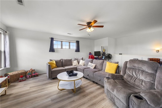 4208 SW Fieldstone Blvd, Bentonville, AR 72712 - living area with a ceiling fan and light wood-style flooring