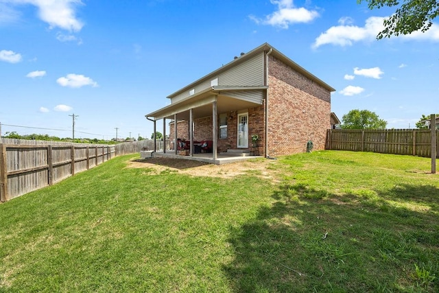 4208 SW Fieldstone Blvd, Bentonville, AR 72712 - back of property with brick siding and a patio