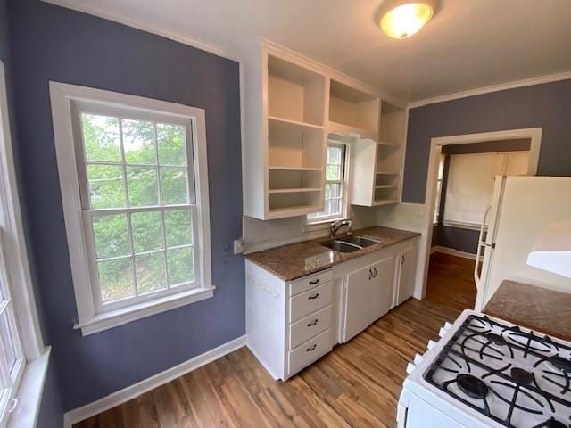 449 N Assembly Dr, Fayetteville, AR 72701 - kitchen featuring a sink, white appliances, white cabinetry, light wood-style floors, and plenty of natural light