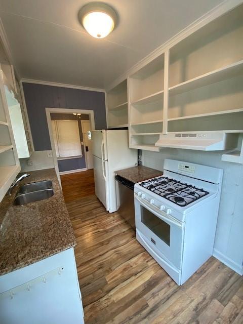 449 N Assembly Dr, Fayetteville, AR 72701 - kitchen with white appliances, range hood, a sink, open shelves, and wood finished floors