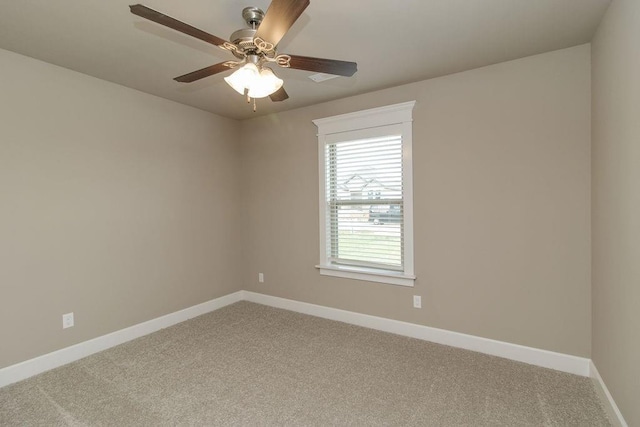 unfurnished room featuring light colored carpet, baseboards, and ceiling fan