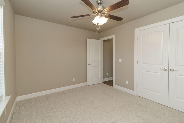 1908 Hale Ln, Pea Ridge, AR 72751 - unfurnished bedroom with carpet floors, baseboards, a closet, and ceiling fan