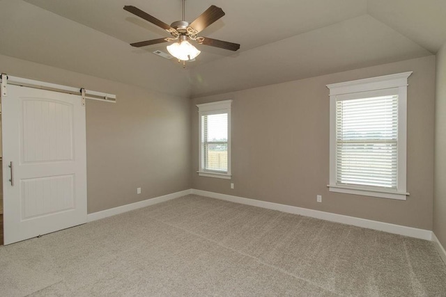 1912 Hale Ln, Pea Ridge, AR 72751 - unfurnished bedroom with vaulted ceiling, baseboards, carpet, a barn door, and ceiling fan
