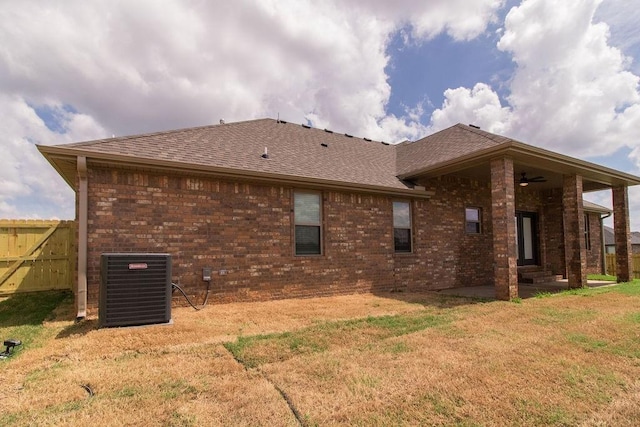1912 Hale Ln, Pea Ridge, AR 72751 - back of property with central AC, a shingled roof, brick siding, and ceiling fan