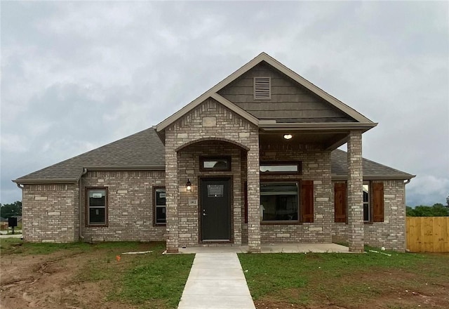 1912 Hale Ln, Pea Ridge, AR 72751 - view of front facade with brick siding, roof with shingles, and stone siding