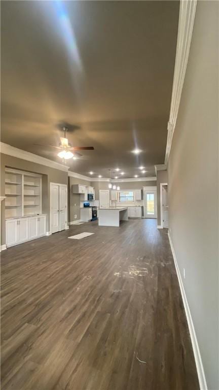 1912 Hale Ln, Pea Ridge, AR 72751 - unfurnished living room with ornamental molding, dark wood finished floors, baseboards, a ceiling fan, and built in features