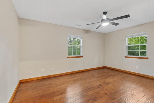 18322 Oakridge Rd, Springdale, AR 72764 - spare room with healthy amount of natural light, hardwood / wood-style floors, and baseboards