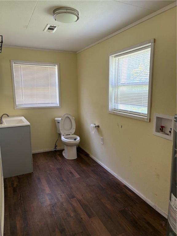 21964 Raven Rd, Elkins, AR 72727 - bathroom with ornamental molding, toilet, wood finished floors, vanity, and baseboards