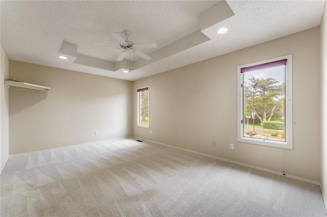 12 Luncarty Ln, Bella Vista, AR 72715 - unfurnished room featuring carpet floors, a ceiling fan, a textured ceiling, recessed lighting, and a tray ceiling