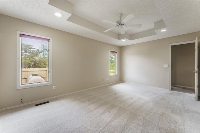 12 Luncarty Ln, Bella Vista, AR 72715 - empty room with a tray ceiling, a textured ceiling, ceiling fan, light carpet, and recessed lighting