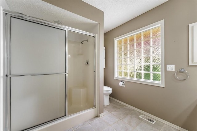 12 Luncarty Ln, Bella Vista, AR 72715 - bathroom with a stall shower, tile patterned flooring, and a textured ceiling