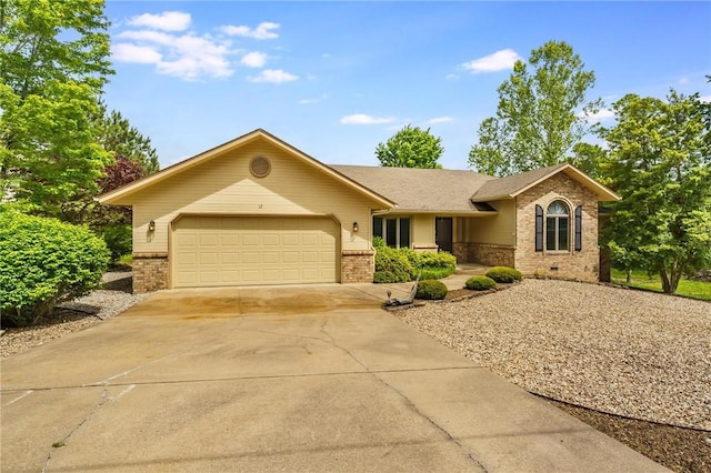 12 Luncarty Ln, Bella Vista, AR 72715 - ranch-style house with brick siding, concrete driveway, and an attached garage