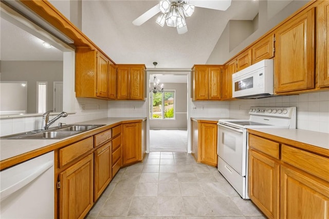 12 Luncarty Ln, Bella Vista, AR 72715 - kitchen featuring white appliances, a ceiling fan, decorative backsplash, light countertops, and brown cabinets