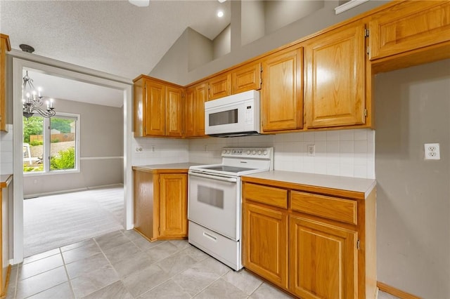12 Luncarty Ln, Bella Vista, AR 72715 - kitchen featuring white appliances, light countertops, backsplash, light tile patterned floors, and vaulted ceiling