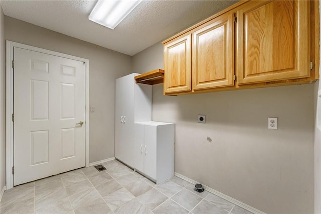 12 Luncarty Ln, Bella Vista, AR 72715 - laundry room featuring cabinet space, electric dryer hookup, and a textured ceiling