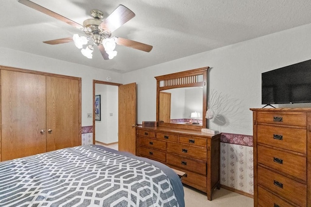 16180 Black Oak Ln, Rogers, AR 72756 - bedroom featuring light colored carpet, a closet, a ceiling fan, and a textured ceiling