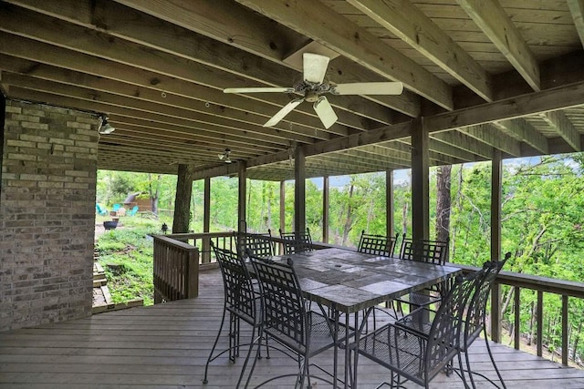 16180 Black Oak Ln, Rogers, AR 72756 - wooden deck with outdoor dining area and ceiling fan