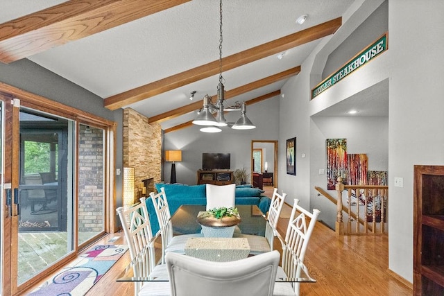 16180 Black Oak Ln, Rogers, AR 72756 - dining space featuring wood finished floors, a chandelier, and baseboards
