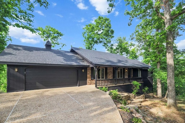 16180 Black Oak Ln, Rogers, AR 72756 - ranch-style home with a porch, an attached garage, concrete driveway, brick siding, and roof with shingles