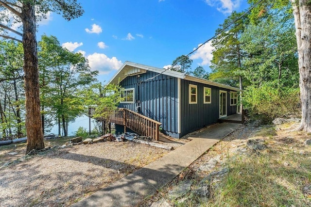 9211 Larue Rd, Rogers, AR 72756 - view of front facade with board and batten siding and a deck