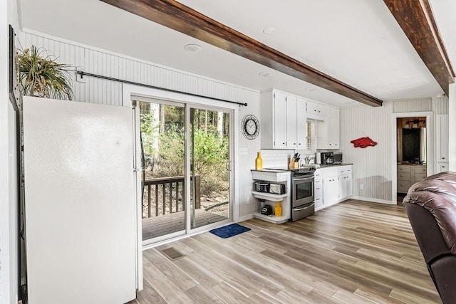 9211 Larue Rd, Rogers, AR 72756 - kitchen featuring freestanding refrigerator, stainless steel electric range, white cabinets, beam ceiling, and light wood-style flooring