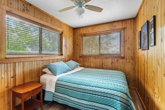 9211 Larue Rd, Rogers, AR 72756 - bedroom featuring wood finished floors, wooden walls, and a ceiling fan