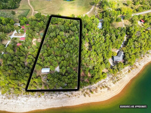 9211 Larue Rd, Rogers, AR 72756 - aerial overview of property's location with property boundaries highlighted and a nearby body of water