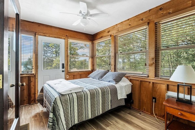 9211 Larue Rd, Rogers, AR 72756 - bedroom featuring wood walls and wood finished floors