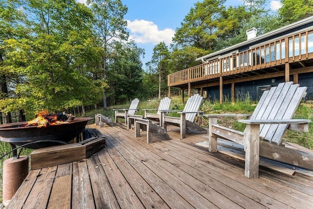 9211 Larue Rd, Rogers, AR 72756 - deck with an outdoor fire pit and view of scattered trees