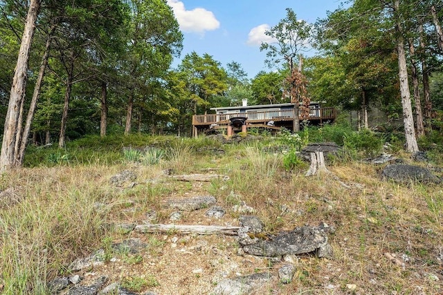 9211 Larue Rd, Rogers, AR 72756 - view of yard featuring a wooden deck and a forest view