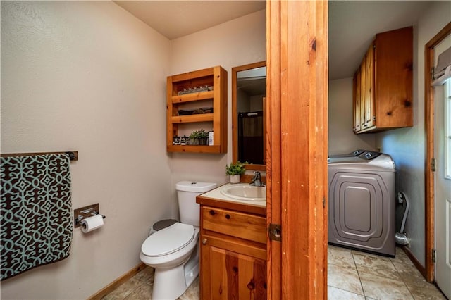 398 Northfork Dr, Berryville, AR 72616 - bathroom featuring washer / clothes dryer, toilet, vanity, and baseboards