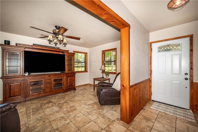 398 Northfork Dr, Berryville, AR 72616 - foyer entrance with ceiling fan, a wainscoted wall, and wood walls