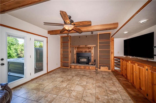 398 Northfork Dr, Berryville, AR 72616 - unfurnished living room with beam ceiling, a wood stove, and ceiling fan