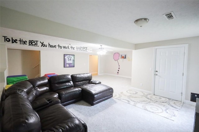 living area with carpet flooring, a ceiling fan, and baseboards