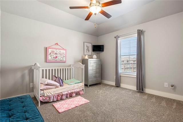 carpeted bedroom featuring baseboards, ceiling fan, and vaulted ceiling