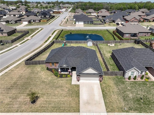 aerial perspective of suburban area with a large body of water