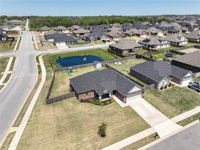 aerial view of residential area with a nearby body of water