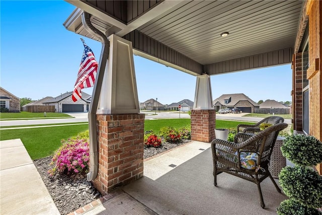 view of patio / terrace featuring covered porch and a residential view
