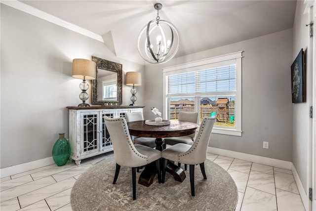 dining area with a chandelier, light marble finish floors, and baseboards
