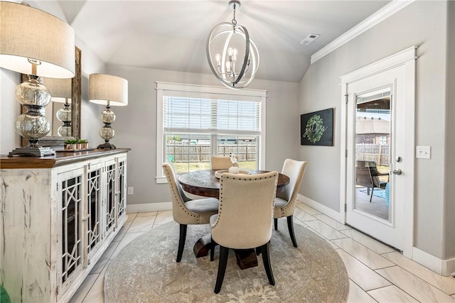 dining area with a chandelier, baseboards, ornamental molding, and lofted ceiling