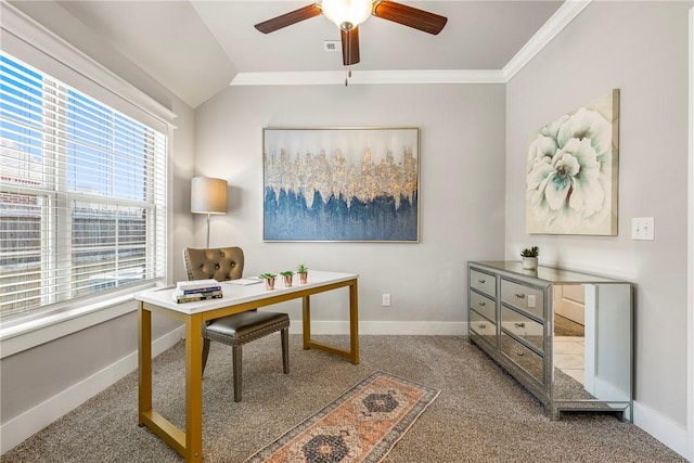 carpeted home office featuring baseboards, ceiling fan, vaulted ceiling, and ornamental molding