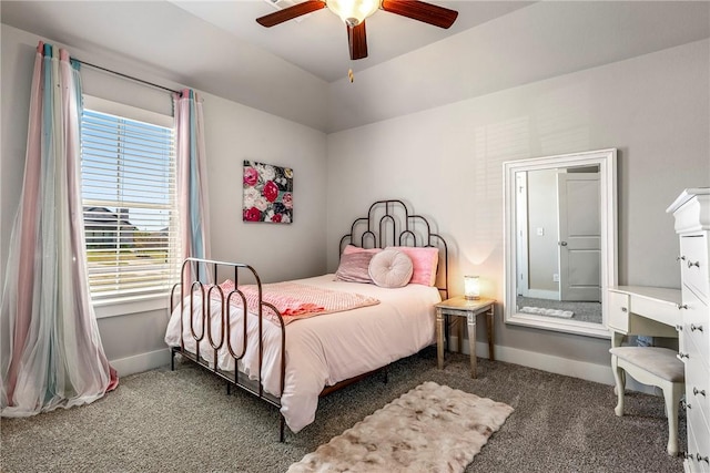 carpeted bedroom featuring baseboards and ceiling fan