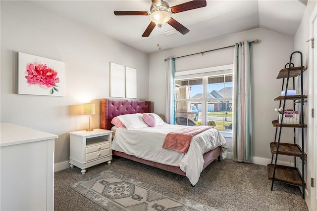 bedroom featuring baseboards, dark carpet, vaulted ceiling, and ceiling fan