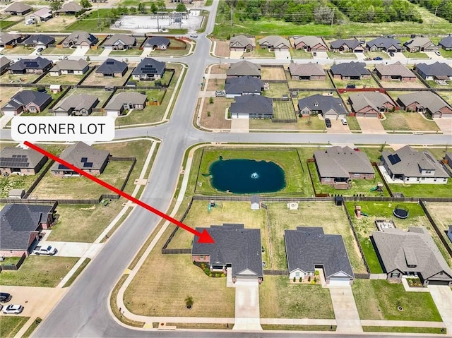 aerial overview of property's location with nearby suburban area and a nearby body of water
