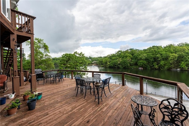 30 Brittany Ln, Bella Vista, AR 72714 - wooden deck featuring outdoor dining area, a water view, and stairs