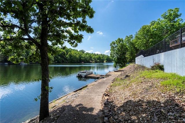 30 Brittany Ln, Bella Vista, AR 72714 - dock featuring a water view and a wooded view