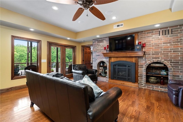 30 Brittany Ln, Bella Vista, AR 72714 - living area featuring a brick fireplace, wood finished floors, recessed lighting, ceiling fan, and baseboards